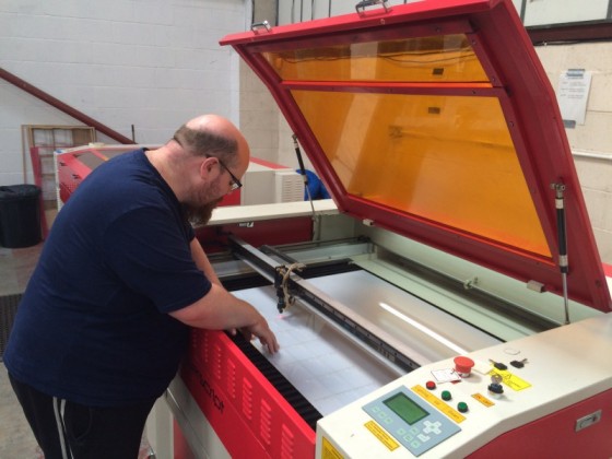 Paul checking quality and accuracy of cutting - QC is done with visual inspection.